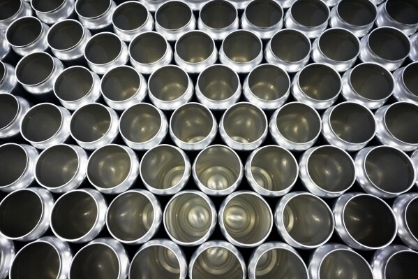 Empty aluminum cans for beer sit at the old Irving Brewing Co. in Chicago, Thursday, March 13, 2025. (AP Photo/Nam Y. Huh, File)